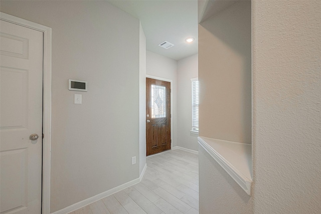 foyer with light wood-type flooring