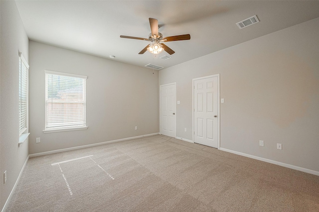 carpeted empty room with ceiling fan