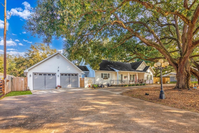 ranch-style home featuring a porch and a garage