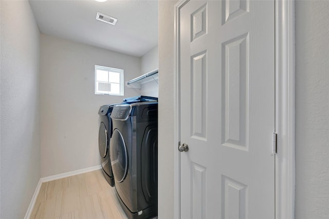 washroom with washer and dryer