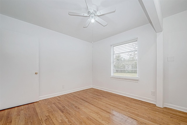 empty room with light hardwood / wood-style floors and ceiling fan