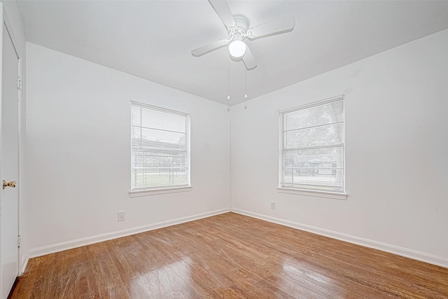 spare room featuring ceiling fan and hardwood / wood-style floors