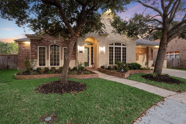 view of front of property with a lawn