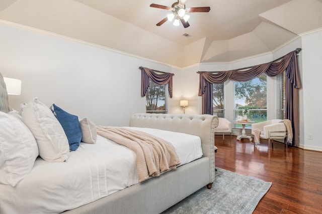 bedroom featuring ornamental molding, dark hardwood / wood-style flooring, ceiling fan, and lofted ceiling