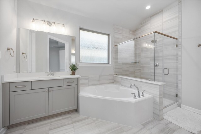 bathroom with plus walk in shower and vanity