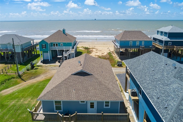 aerial view with a water view and a view of the beach