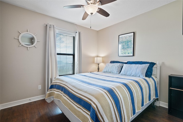 bedroom featuring ceiling fan and dark hardwood / wood-style floors