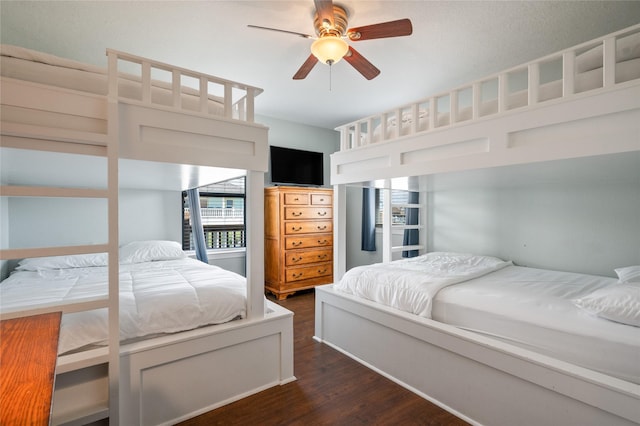 bedroom featuring ceiling fan and dark hardwood / wood-style flooring