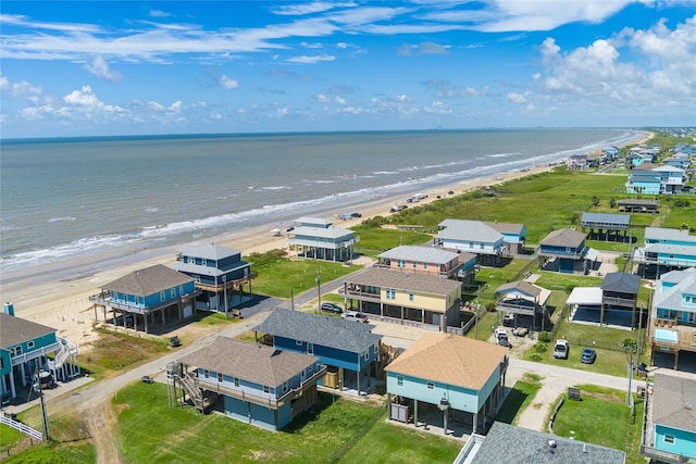 aerial view with a water view and a beach view