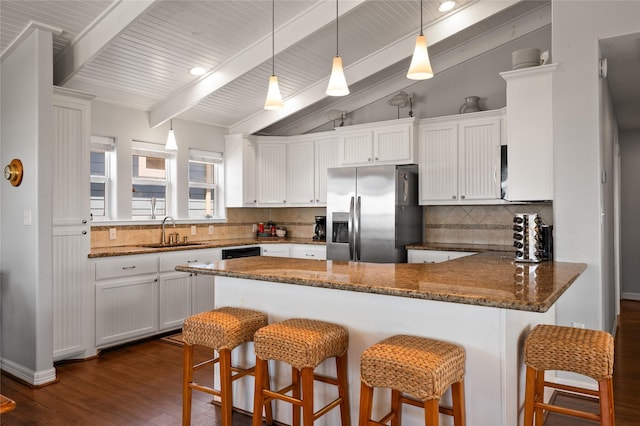 kitchen with sink, stainless steel fridge with ice dispenser, decorative backsplash, white cabinetry, and kitchen peninsula