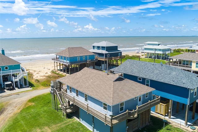 aerial view featuring a view of the beach and a water view