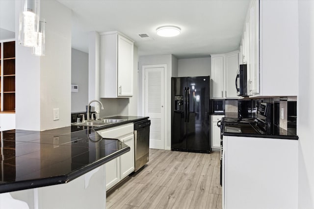 kitchen with black refrigerator with ice dispenser, dishwasher, white cabinets, and pendant lighting