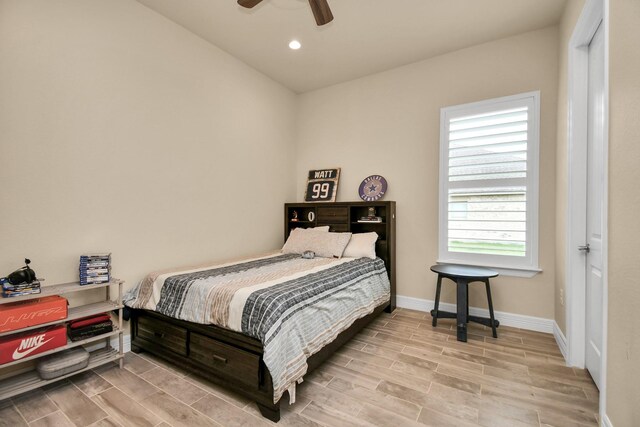 bedroom with ceiling fan and light hardwood / wood-style floors