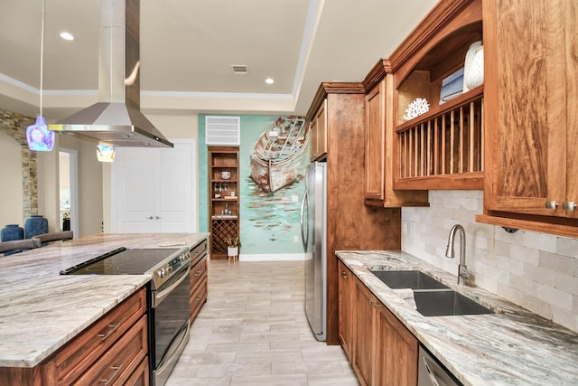 kitchen with island range hood, sink, light stone counters, and appliances with stainless steel finishes