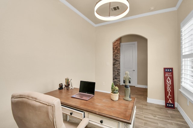 office with light wood-type flooring and ornamental molding