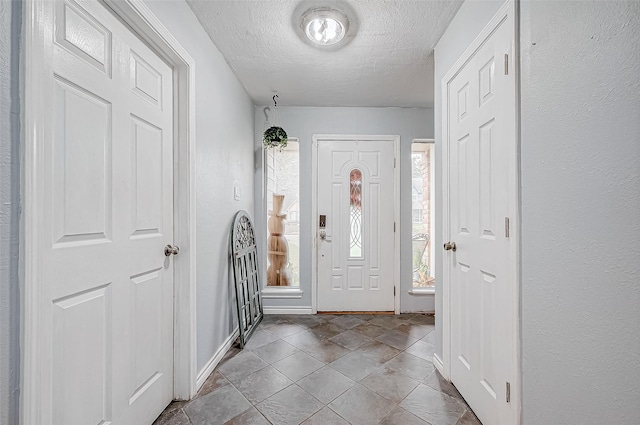 entrance foyer with a textured ceiling