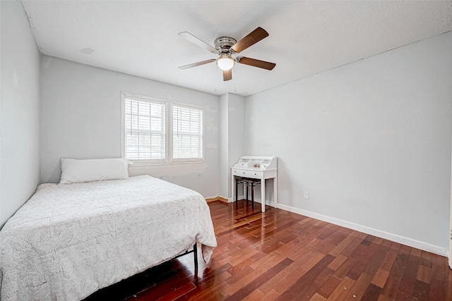 bedroom with ceiling fan and hardwood / wood-style floors