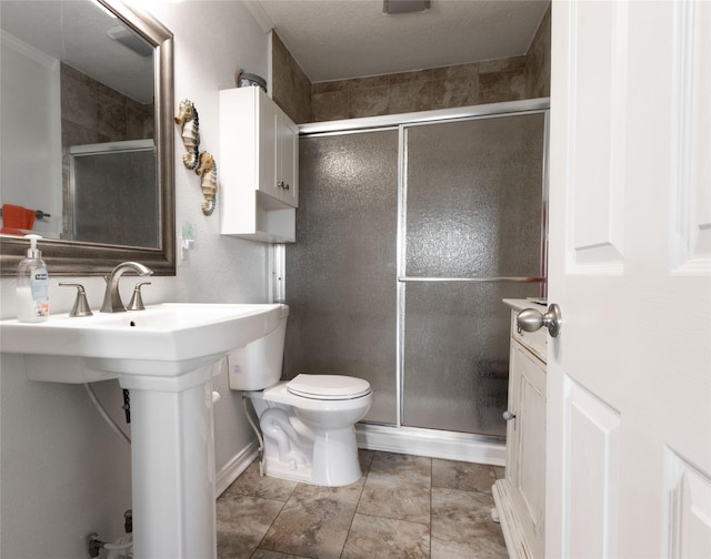 bathroom featuring toilet and an enclosed shower