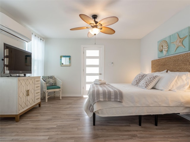 bedroom featuring hardwood / wood-style floors and ceiling fan