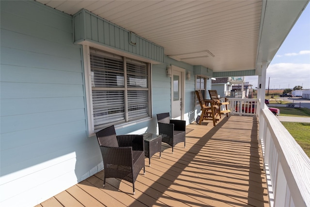 wooden deck featuring covered porch