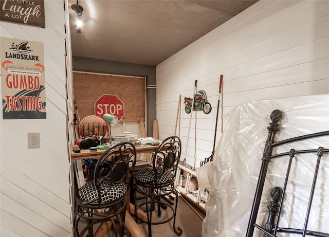 dining area featuring wooden walls