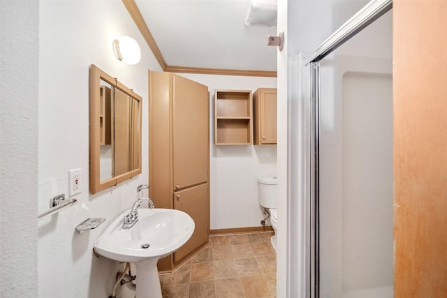 bathroom with toilet, an enclosed shower, ornamental molding, and sink