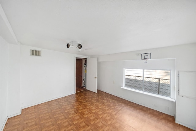 unfurnished room featuring light parquet floors