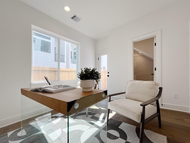 home office with dark wood-type flooring