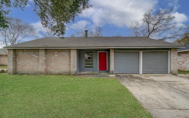 single story home featuring a garage and a front lawn