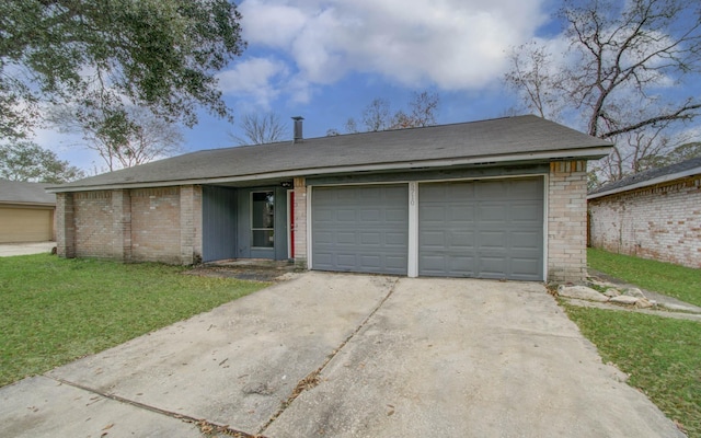 single story home with a garage and a front lawn