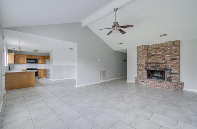 unfurnished living room featuring ceiling fan, sink, beamed ceiling, high vaulted ceiling, and a fireplace