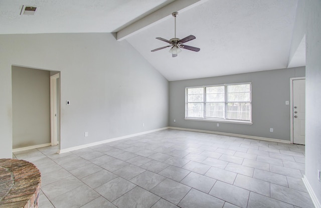 unfurnished living room featuring light tile patterned floors, vaulted ceiling with beams, a textured ceiling, and ceiling fan