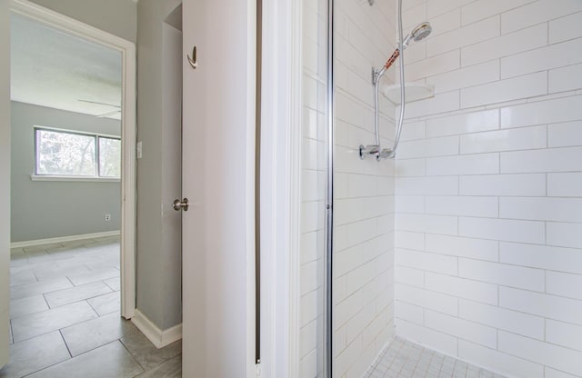 bathroom with a tile shower