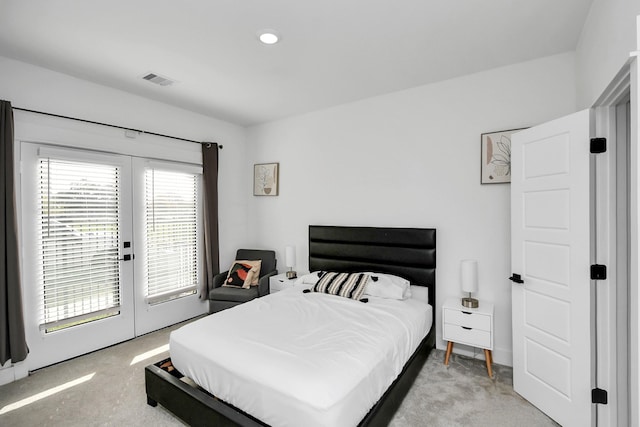 bedroom featuring light carpet, french doors, and access to outside