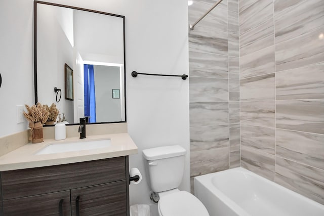 full bathroom with vanity, toilet, and tiled shower / bath