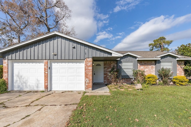 ranch-style home with a front yard and a garage