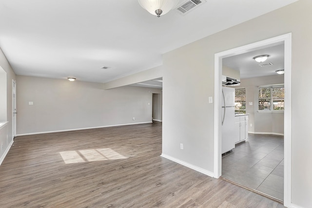 empty room featuring hardwood / wood-style flooring