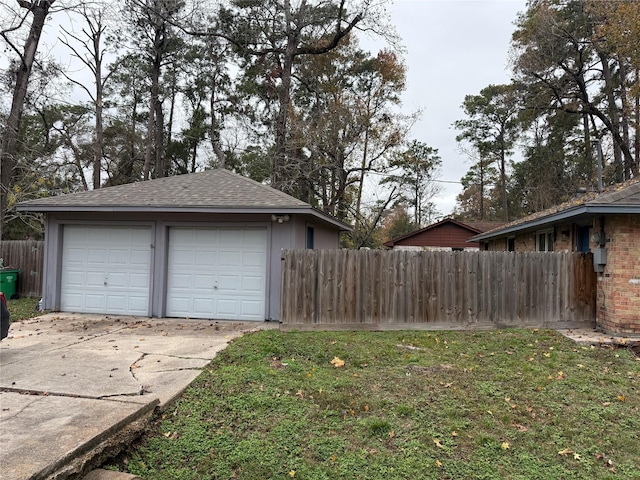 garage featuring a lawn