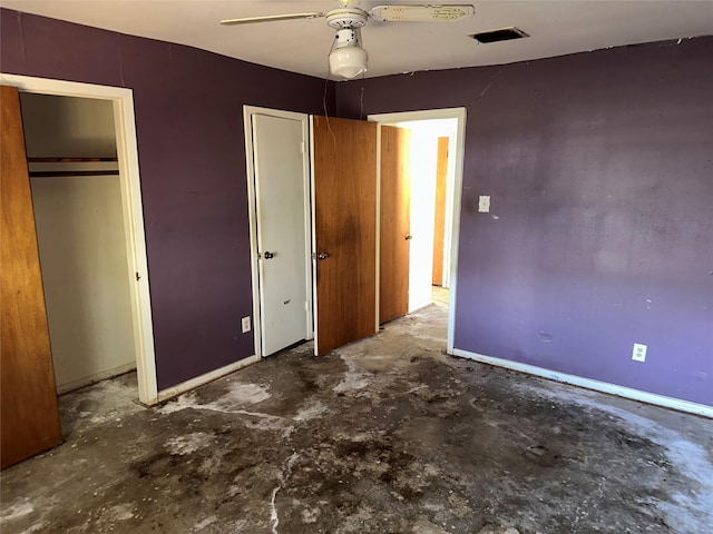 unfurnished bedroom with ceiling fan and concrete flooring