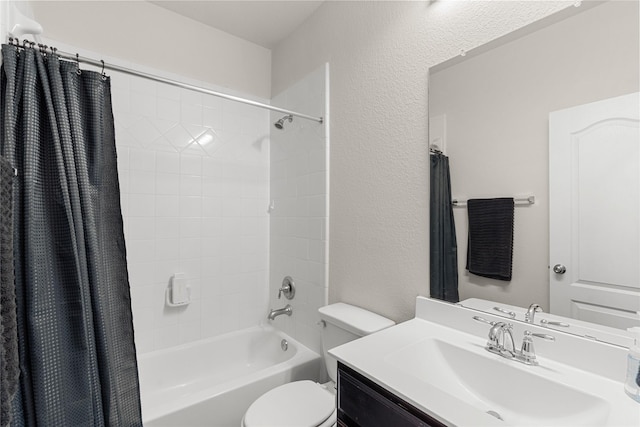 full bathroom featuring vanity, shower / bath combination with curtain, and toilet