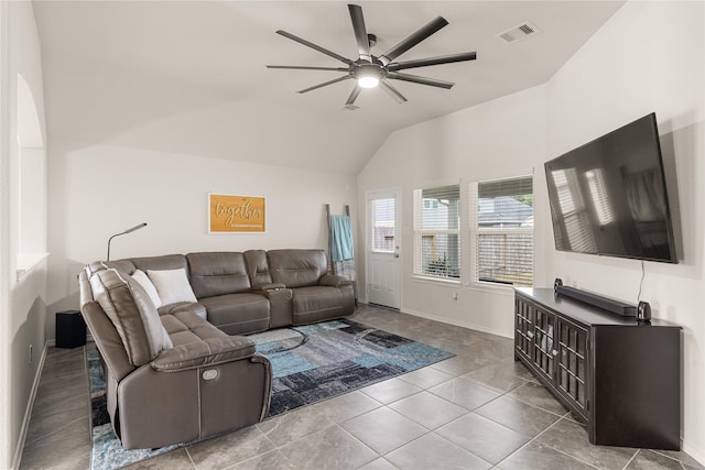 living room with ceiling fan, light tile patterned flooring, and vaulted ceiling