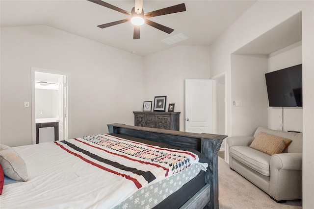 carpeted bedroom featuring ceiling fan, lofted ceiling, and ensuite bathroom