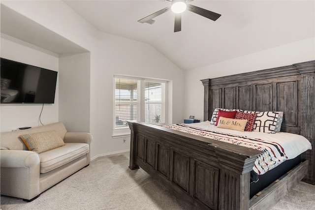 carpeted bedroom with vaulted ceiling and ceiling fan