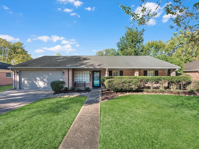 ranch-style house featuring a front yard and a garage