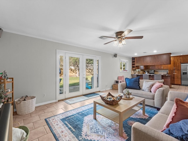 living room with light tile patterned floors, french doors, crown molding, and ceiling fan