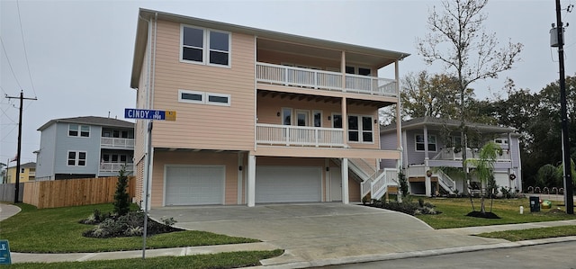 view of front of house with a garage and a front lawn