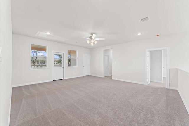 carpeted empty room featuring ceiling fan