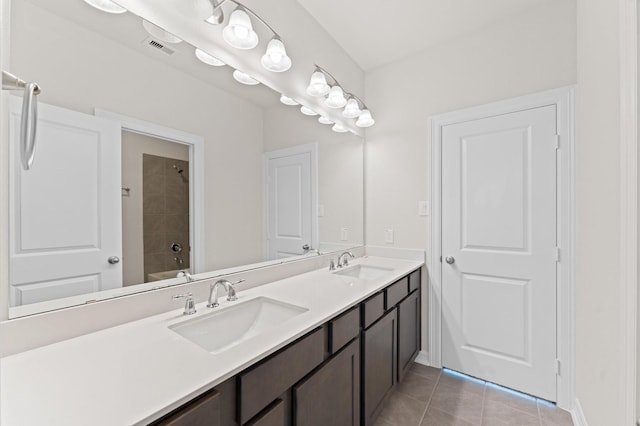 bathroom featuring vanity, tile patterned floors, and shower / tub combination