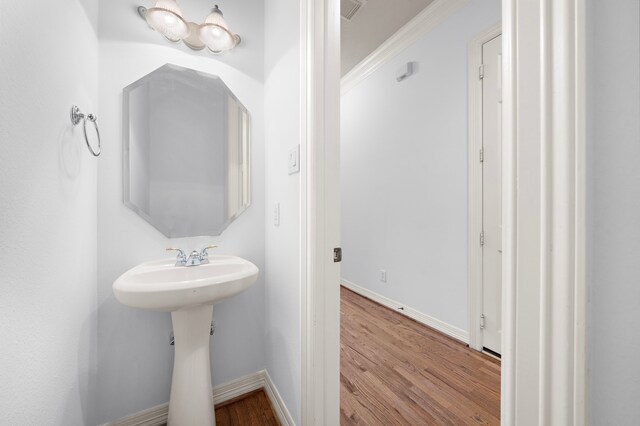 bathroom with hardwood / wood-style flooring