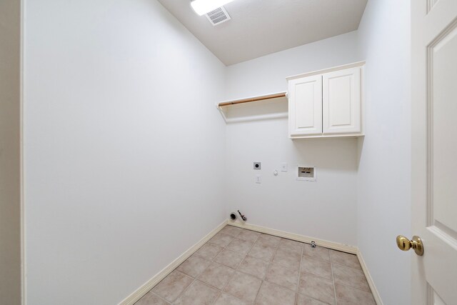 laundry area featuring cabinets, gas dryer hookup, hookup for a washing machine, and hookup for an electric dryer